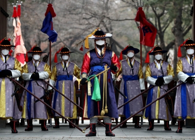 South Korean imperial guards conducting a re-enactment with face masks due to the coronavirus.