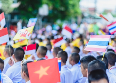 Varrall - ASEAN Day students and flags - AdobeStock 