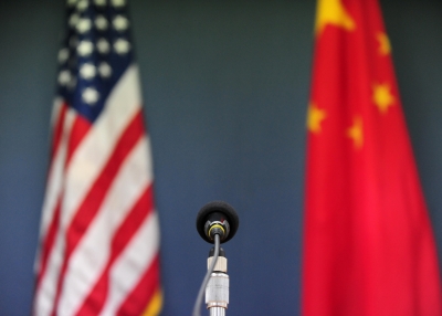 The US and China flags stand behind a microphone awaiting the arrival of US Senator John McCain, who was joined by Senators Lindsey Graham Amy Klobuchar for a press conference at the US Embassy in Beijing on April 9, 2009 during the China stop of the Congressional Delegation's fact-finding Asia-tour. Senator McCain said he urged Chinese officials in talks here to back a strong United Nations response to North Korea's rocket launch, but indicated China had resisted.