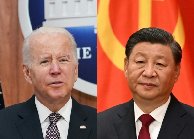 This combination of pictures created on November 11, 2022 shows US President Joe Biden (L) addresses the Major Economies Forum on Energy and Climate from the South Court Auditorium of the Eisenhower Executive Office Building, next to the White House, in Washington, DC on June 17, 2022 and China's President Xi Jinping (R) speaks after walking with members of the Chinese Communist Party's new Politburo Standing Committee, the nation's top decision-making body, to meet the media in the Great Hall of the People