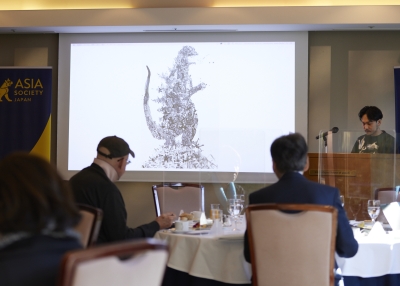 Nishigaki showing his work of Godzilla-themed work