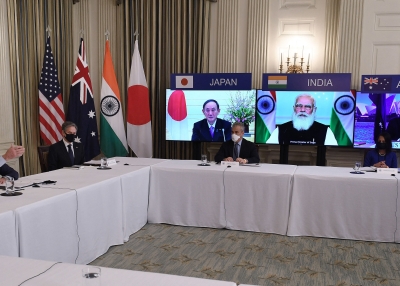 US President Joe Biden (L), with Secretary of State Antony Blinken (2nd L), meets virtually with members of the "Quad" alliance of Australia, India, Japan and the US, in the State Dining Room of the White House in Washington, DC, on March 12, 2021. - On screens are Japanese Prime Minister Yoshihide Suga, Indian Prime Minister Narendra Modi and Australian Prime Minister Scott Morrison.
