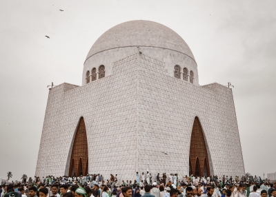 people walking near white concrete building during daytime Tomb of Quaid e Azam Muhammad Ali Jinnah