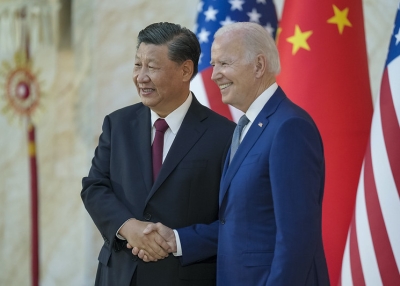 President Joe Biden greets and poses for a photo with Chinese President Xi Jingping ahead of their bilateral meeting, Monday, November 14, 2022, at the Mulia Resort in Bali, Indonesia.
