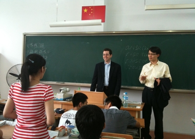Chris Livaccari and Jeff Wang speaking with students in Harbin, China.
