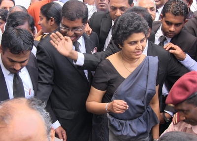 Sri Lanka's Chief Justice Shirani Bandaranayake (C) walks from the Supreme Court in Colombo on December 4, 2012. (Vikalpa/Groundviews/CPA/flickr)