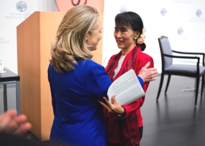 U.S. Secretary of State Hillary R. Clinton greets Aung San Suu Kyi before the Myanmar parliamentarian spoke at the U.S. Institute of Peace in Washington, D.C., Sept. 18, 2012 (Asia Society/Joshua Roberts)