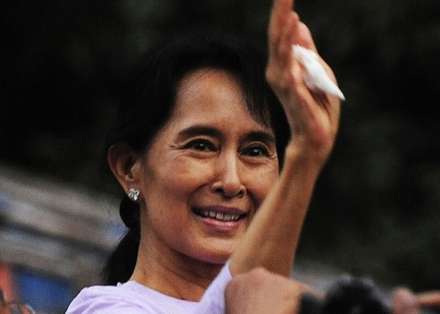 Myanmar's opposition leader Aung San Suu Kyi waves to supporters after her release from house arrest in Yangon November 13, 2010. (STR/AFP/Getty Images)