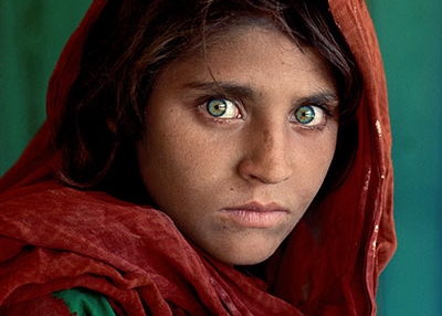 Sharbat Gula, “Afghan Girl,” at Nasir Bagh refugee camp near Peshawar, Pakistan, 1984. © Steve McCurry.
