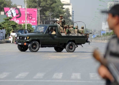 Pakistani soldiers patrol after an attack on the army headquarters in the garrison city Rawalpindi on October 10, 2009. The attack ended with all four suspects killed, according to a military spokesman. (Farooq Naeem/AFP/Getty Images)