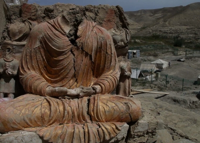 A gold-plated seated Buddha overlooks the China Metallurgical Group Corporation mine. (Brent Huffman)