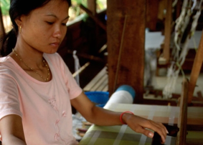 One of the 40 artisans working for Lao Textiles, the company founded by designer Carol Cassidy (see below).  
