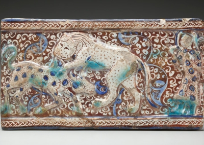 Molded Luster Tile with Raised Braided Border and Cowherd Witnessing a Lion Attack a Calf Against a Floral Background, Iran, first half of the 13th century, Ceramic, glaze and paint, Gift of Mary Vanderpool Pennington, 1949 Howard W. Hayes Collection, Collection of the Newark Museum 49.503