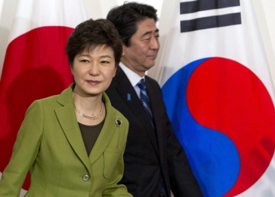South Korean President Park Geun-hye (L) and Japanese Prime Minister Shinzo Abe arrive for a trilateral meeting with the U.S. president in The Hague on March 25, 2014. (Saul Loeb/AFP/Getty Images)