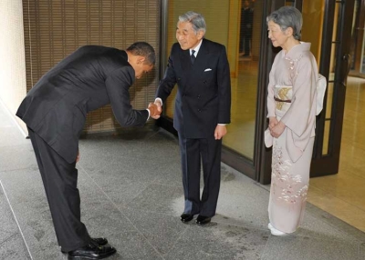 President Obama bows as he shakes hands with Japanese Emperor Akihito and as Empress Michicko looks on at the Imperial Palace in Tokyo, on November 14, 2009. The bow has sparked controversy in the US where some argue that no sitting president should bow to another head of state. (Mandel Ngan/AFP/Getty Images)