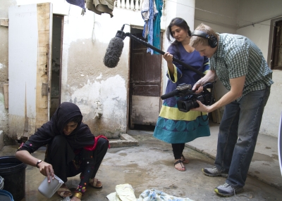 Co-director Sharmeen Obaid-Chinoy (C) on the set 