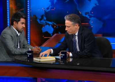 Anand Giridharadas with Jon Stewart on Jan. 24, 2011. (Comedy Central)