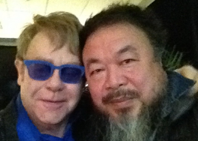 A grainy shot from Ai Weiwei's Instagram of him (R) and singer Elton John (L) backstage at the singer's Beijing concert on November 25. (Ai Weiwei/Instagram) 