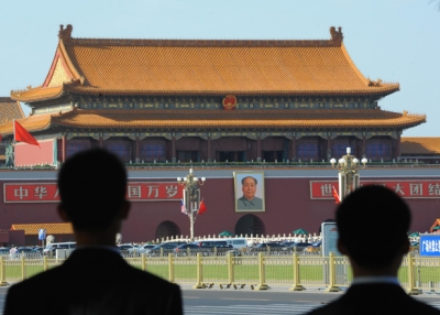 Chinese security watch over Tiananmen Square prior to the welcoming ceremony for Malaysian Prime Minister Najib Razak in Beijing on June 3, 2009. (Goh Chai Hin/AFP/Getty Images)