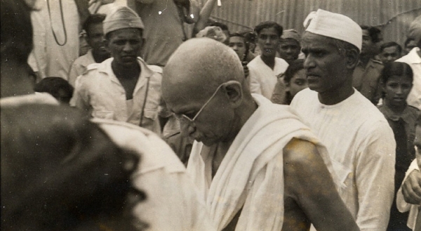 Mahatma Gandhi arrives at the A.I.C.C. meeting in Bombay on August 7, 1942. Talbot described Gandhi as &quot;the most efficient worker in India,&quot; with &quot;the knack of resting his body completely while his mind carries on.&quot; (Phillips Talbot)