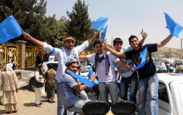 Young men cheer in support of Abdullah Abdullah after an election rally at Gardez, in Paktya province, on August 17, the last day of campaigning. (Massoud Hossaini/AFP/Getty Images)