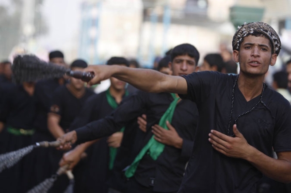 Shiite Muslim pilgrims self-flagellate as they gather at Imam Musa al-Kadhim Mosque in Northern Baghdad July 7th.