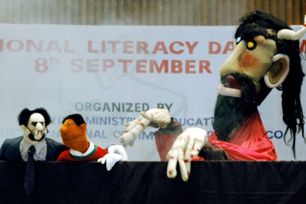 Pakistani puppet participates in literacy event. (Farooq Naeem/Getty Images)