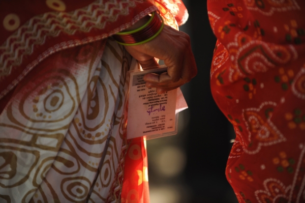 An Indian voter holds her identity card at a polling station in India's Bihar state on October 21, 2010. (DIPTENDU DUTTA/AFP/Getty Images)