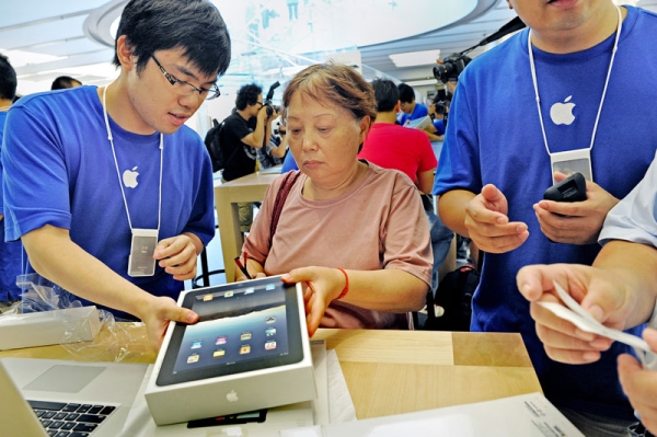 A customer buys an iPad at the Apple store in Shanghai on September 17, 2010. Apple officially launched its iPad in China, a sure-fire winner, analysts say, even though Chinese customers have been able to buy the tablet computer on the grey market for months. (Philippe Lopez/AFP/Getty Images) 