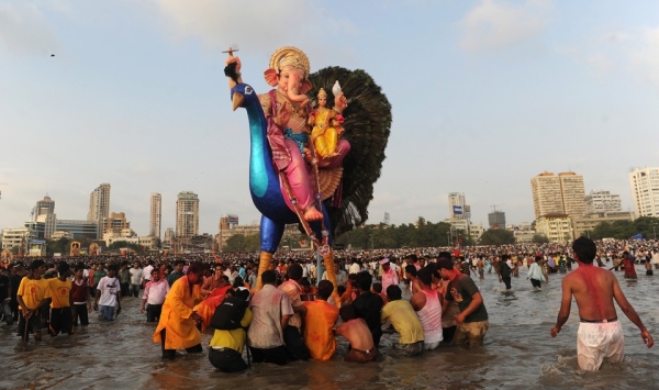 Mumbaikers immerse an idol of Ganesh into the Arabian Sea on September 22, 2010. (Punit Paranjpe/AFP/Getty Images)