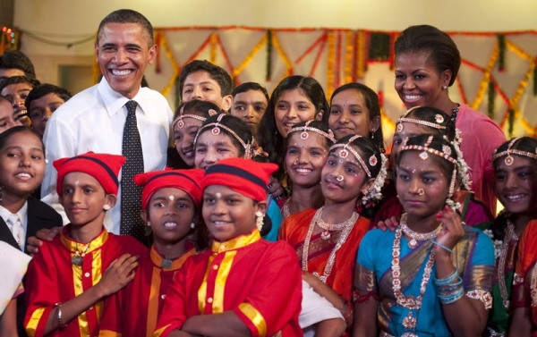 President Obama (L) and First Lady Michelle Obama (R) pose with performers during a cultural event at The Holy Name High School in Mumbai on November 7, 2010. The Obamas partook in the ceremony by joining the students in a dance. (Jim Watson/AFP/Getty Images)