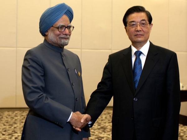 Indian Prime Minister Manmohan Singh (L), is greeted by Chinese president Hu Jintao, on April 13, 2011 in Sanya, Hainan Province, China for the 2011 BRICS Summit. (Nelson Ching/Pool/Getty Images)