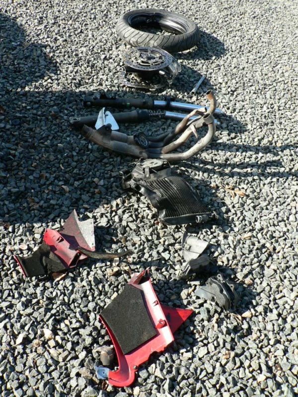 Mangled parts from Khan's motorcycle after his crash in Romania. (Moin Khan)