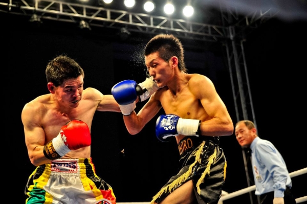 Qi Moxiang (L) vs. Akihiro Matsumoto of Japan (R) at the Vacant WBC Asia Super Bantamweight Championship on June 28, 2011. Their bout is featured in China Heavyweight. (EyeSteelFilm)