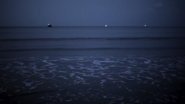 A scene from Jason Taylor's 'Goa . fishing net ~ profit,' depicting calm waters in Goa.