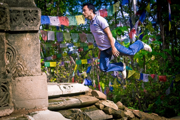 A young man bounces through the ruins in Surkhet, Nepal on July 5, 2012. (satyamjoshi/Flickr)