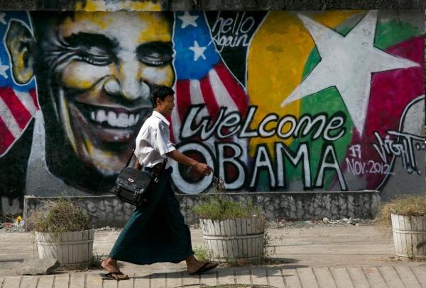 In Yangon, a Burmese man walks by a mural depicting U.S. President Barack Obama as the city gets ready for the first visit by a serving U.S. President, on Nov. 17, 2012. (Paula Bronstein/Getty Images)