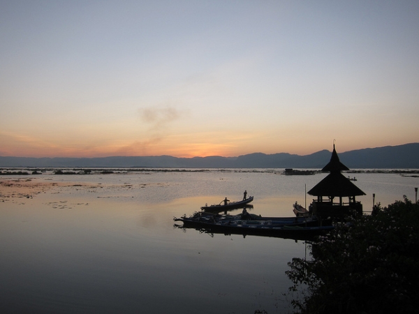 Boats docked during sunset on Inle Lake in Myanmar on December 13, 2012. (isriya/Flickr)