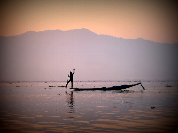 A fisherman waves from the water at Inle Lake in Myanmar on Febryary 23, 2013. (kudumomo/Flickr)