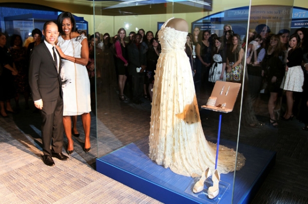 Michelle Obama stands with inaugural dress designer Jason Wu in front of the inaugural gown she wore to the inaugural balls and is now on display at the Smithsonian Museum of American History in Washington, DC  on March 9, 2010. (Mark Wilson/Getty Images)