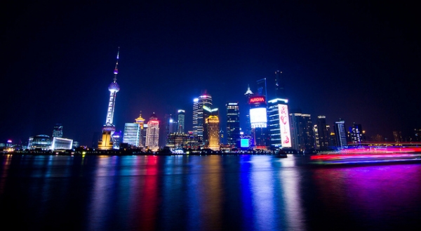 Multicolored lights paint the waters of Shanghai, China on March 24, 2013. (serg_ulixes/Flickr)