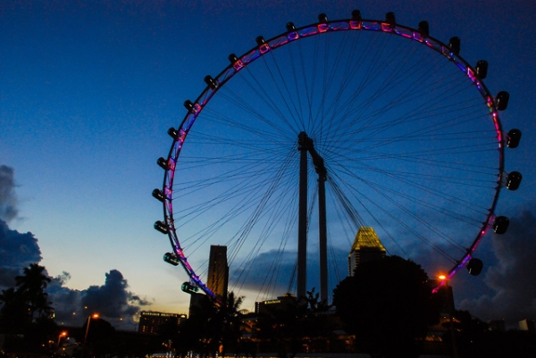A ferris wheel is lit up at dusk in Singapore on May 5, 2013. (Eduardo S. Seastres)