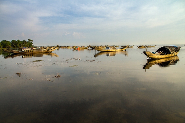 Boats remain motionless on calm waters in Hue, Vietnam on May 23, 2013. (Hoang Giang Hai/Flickr)
