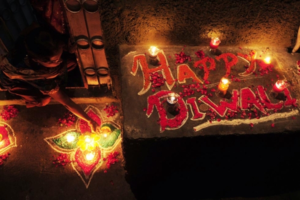 For Diwali, the festival of lights, people honor the Hindu goddess of wealth, Lakshmi, decorate their homes with flowers and diyas (earthen lamps), and celebrate the homecoming of the God Ram after he vanquished the demon king Ravana. (Rizwan Tabassum/AFP/Getty Images)