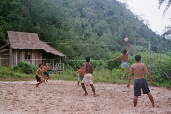 A group of boys challenge each other in a game of volleyball in Cambodia on June 6, 2013. (Dan Peiron/Flickr)