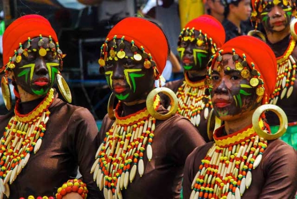 A group of women celebrate the Dinagyang Festival that honors Santo Niño and the arrival of Malay tribes in Panay in Iloilo, Philippines on January 27, 2013. (Eduardo S. Seastres)