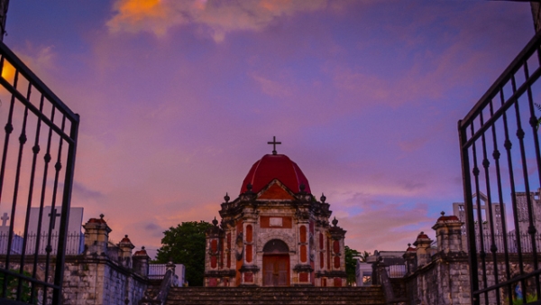 A vibrant purple sky cloaks Campo Santo de San Joaquin, an old cemetery, in Iloilo, Philippines on November 02, 2013. (Eduardo S. Seastres)