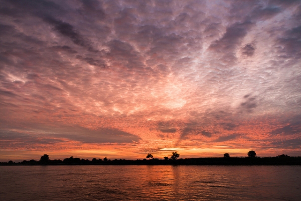 A majestic sunrise illuminates calm waters in Myanmar on November 19, 2013. (Anthony Tong Lee/Flickr) 