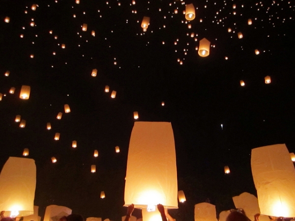 Hundreds of sky lanterns light up the night's sky during the Yi Peng Festival in Chiang Mai, Thailand on November 16, 2013. (shelmac/Flickr)
