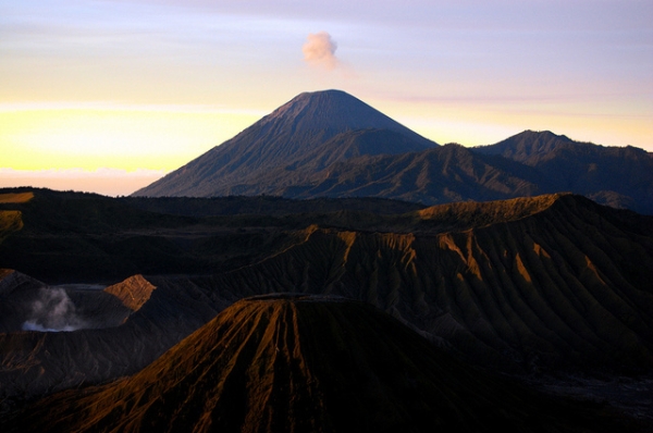 Mount Semeru towers over the rugged volcanoes of Bromo Tengger Semeru National Park in East Java, Indonesia on November 17, 2013. (deepgoswami/Flickr)